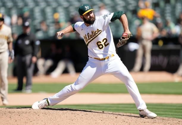 Lou Trivino of the Oakland Athletics pitches against the San Diego Padres in the top of the tenth inning at RingCentral Coliseum on August 04, 2021...