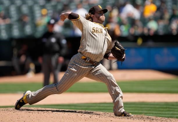 Pierce Johnson of the San Diego Padres pitches against the Oakland Athletics in the bottom of the seventh inning at RingCentral Coliseum on August...