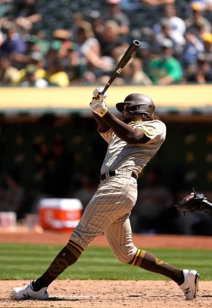 Jake Marisnick of the San Diego Padres bats against the Oakland Athletics in the top of the seventh inning at RingCentral Coliseum on August 04, 2021...