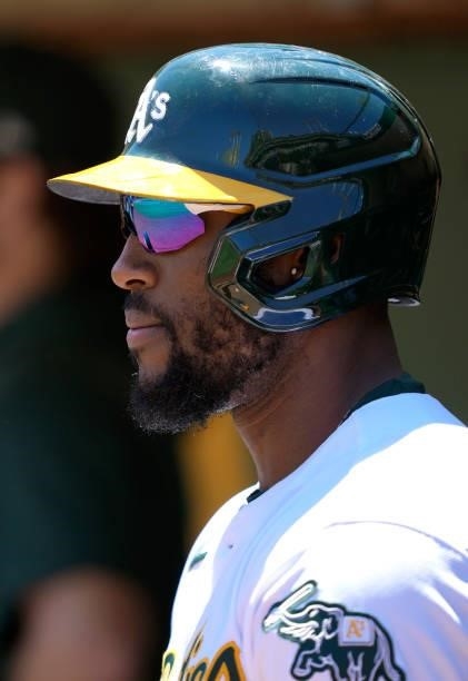 Starling Marte of the Oakland Athletics looks on from the dugout against the San Diego Padres in the bottom of the second inning at RingCentral...