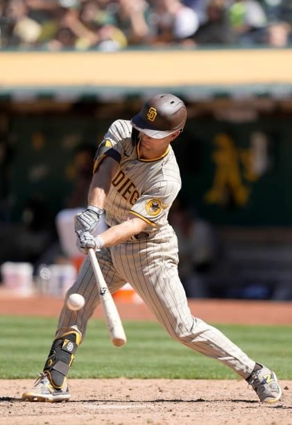 Adam Frazier of the San Diego Padres bats against the Oakland Athletics in the top of the tenth inning at RingCentral Coliseum on August 04, 2021 in...