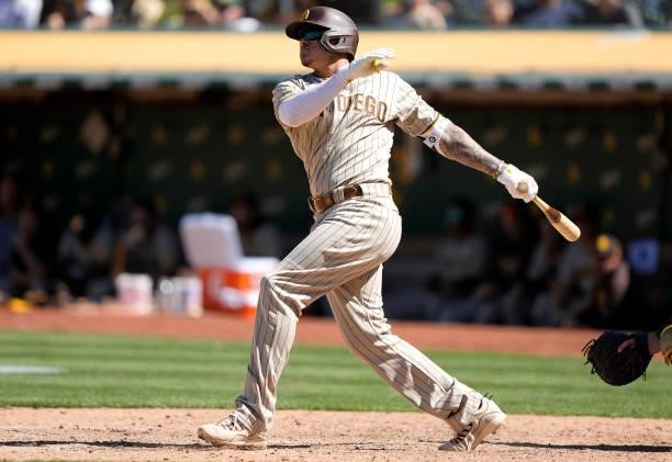 Manny Machado of the San Diego Padres bats against the Oakland Athletics in the top of the tenth inning at RingCentral Coliseum on August 04, 2021 in...