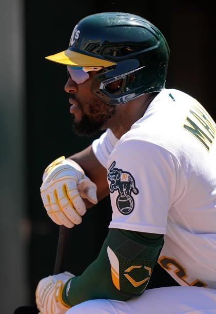Starling Marte of the Oakland Athletics looks on from the dugout against the San Diego Padres in the bottom of the seventh inning at RingCentral...