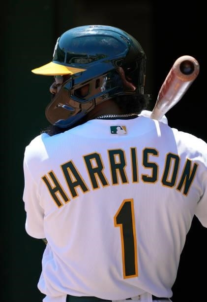 Josh Harrison of the Oakland Athletics looks on from the dugout against the San Diego Padres in the bottom of the first inning at RingCentral...