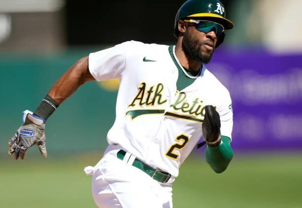 Starling Marte of the Oakland Athletics rounds third base to score the winning run against the San Diego Padres in the bottom of the tenth inning at...