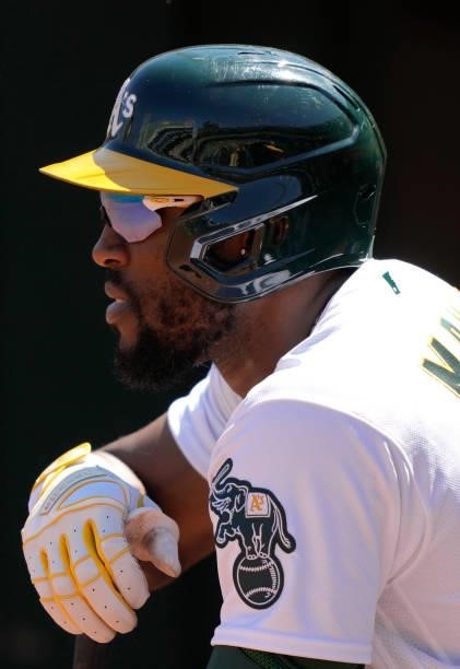 Starling Marte of the Oakland Athletics looks on from the dugout against the San Diego Padres in the bottom of the seventh inning at RingCentral...