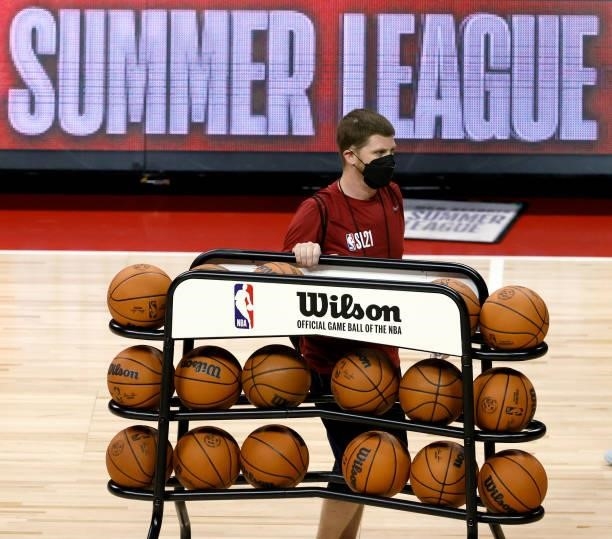Rack of basketballs is wheeled off the court before a game between the Dallas Mavericks and the Philadelphia 76ers during the 2021 NBA Summer League...
