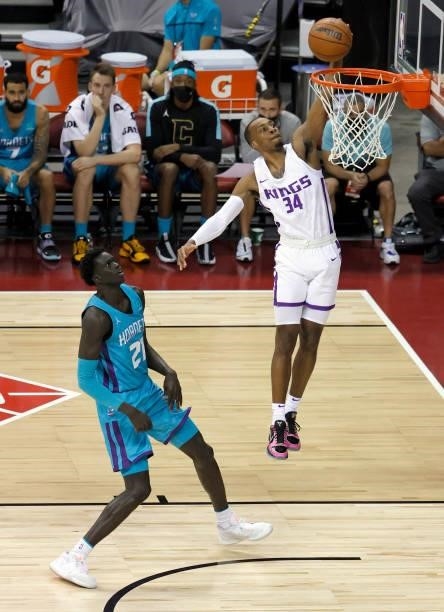 Matt Coleman III of the Sacramento Kings tries to dunk ahead of JT Thor of the Charlotte Hornets during the 2021 NBA Summer League at the Thomas &...
