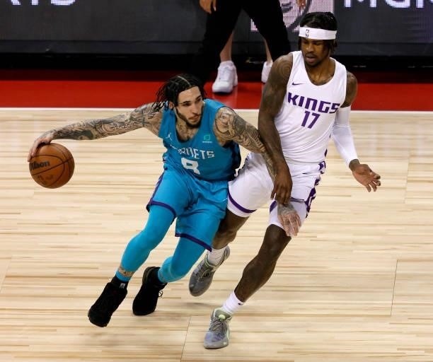 LiAngelo Ball of the Charlotte Hornets drives against Ade Murkey of the Sacramento Kings during the 2021 NBA Summer League at the Thomas & Mack...