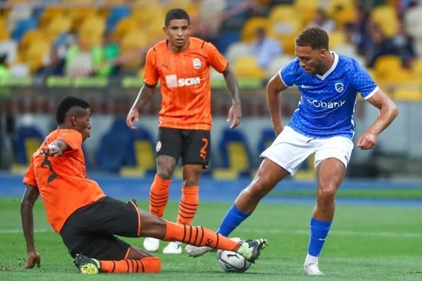 Vitao of Shakhtar Donetsk fights for the ball with Cyriel Dessers of KRC Genk during the UEFA Champions League: Third Qualifying Round Leg Two match...