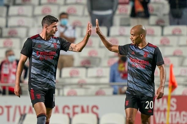 Roman Yaremchuk of SL Benfica celebrates with Joao Mario after scoring their side's second goal during the UEFA Champions League Third Qualifying...
