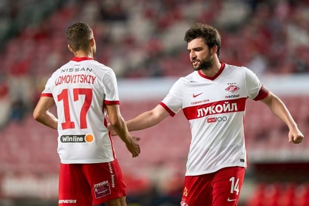 Georgiy Dzhikiya of FC Spartak Moskva encourages Aleksandr Lomovitskiy during the UEFA Champions League Third Qualifying Round Leg Two match between...