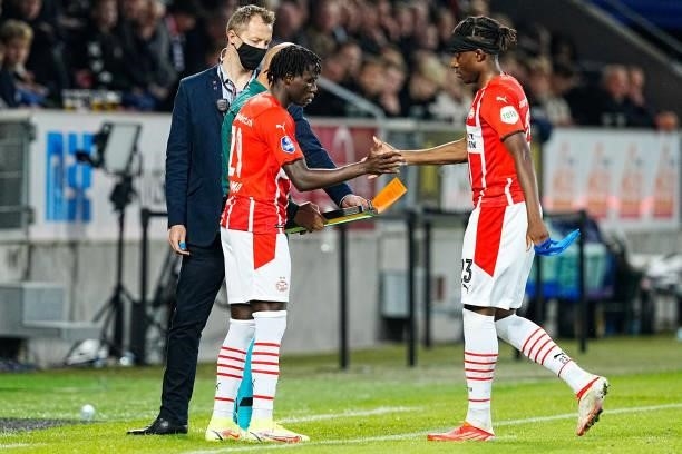 Philipp Mwene of PSV hang five with Noni Madueke of PSV during the UEFA Champions League - Third qualifying round match between FC Midtjylland and...