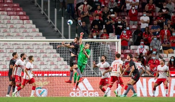 Aleksandr Maksimenko of FC Spartak Moskva competes for the ball with Morato of SL Benfica during the UEFA Champions League Third Qualifying Round Leg...