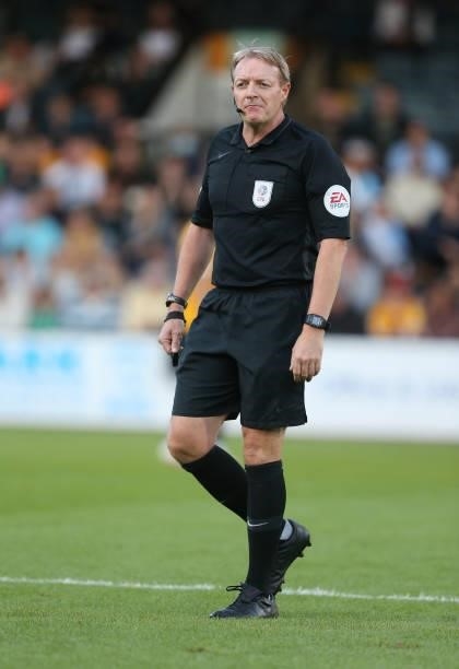 Referee Trevor Kettle in action during the Carabao Cup 1st Round match between Cambridge United and Swindon Town at Abbey Stadium on August 10, 2021...