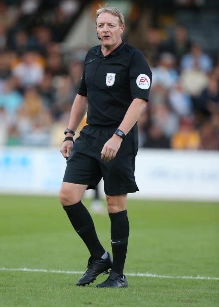 Referee Trevor Kettle in action during the Carabao Cup 1st Round match between Cambridge United and Swindon Town at Abbey Stadium on August 10, 2021...