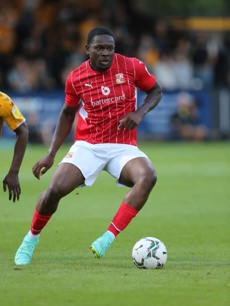 Tyreece Simpson of Swindon Town in action during the Carabao Cup 1st Round match between Cambridge United and Swindon Town at Abbey Stadium on August...
