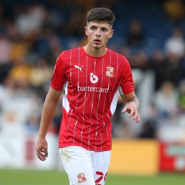 Harry Parsons of Swindon Town in action during the Carabao Cup 1st Round match between Cambridge United and Swindon Town at Abbey Stadium on August...