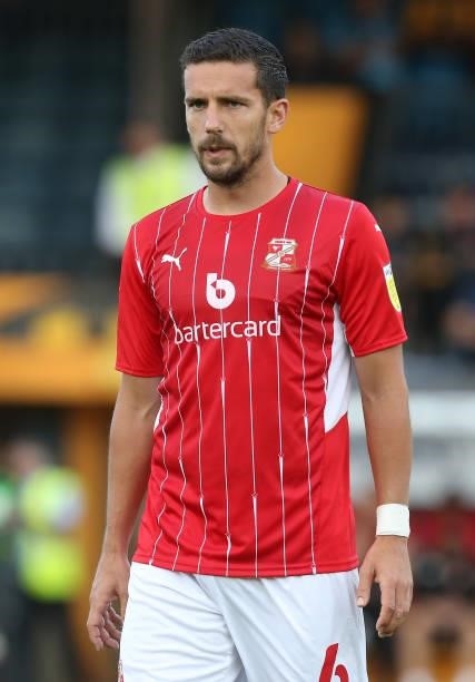 Mathieu Baudry of Swindon Town in action during the Carabao Cup 1st Round match between Cambridge United and Swindon Town at Abbey Stadium on August...