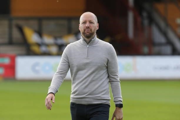 Swindon Town manager Ben Garner looks on prior to the Carabao Cup 1st Round match between Cambridge United and Swindon Town at Abbey Stadium on...