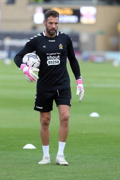 Cambridge United goalkeeper coach Mark Bunn in action during the pre match warm up prior to the Carabao Cup 1st Round match between Cambridge United...