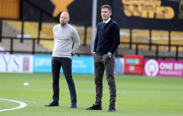 Swindon Town Manager Ben Garner and Director of Football Ben Chorley look on prior to the Carabao Cup 1st Round match between Cambridge United and...