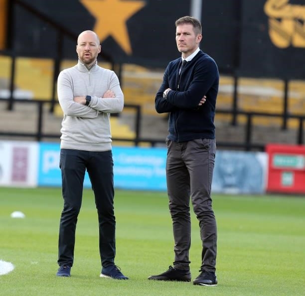 Swindon Town Manager Ben Garner and Director of Football Ben Chorley look on prior to the Carabao Cup 1st Round match between Cambridge United and...