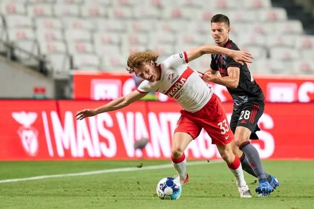 Julian Weigl of SL Benfica competes for the ball with Alex Kral of FC Spartak Moskva during the UEFA Champions League Third Qualifying Round Leg Two...