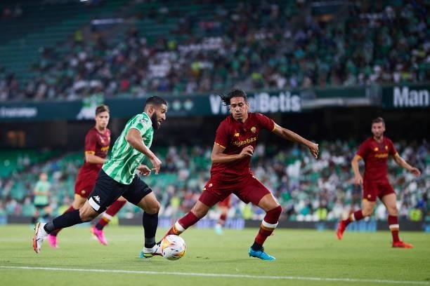 Nabil Fekir of Real Betis competes for the ball with Smalling of AS Roma during a friendly match between Real Betis and AS Roma at Estadio Benito...