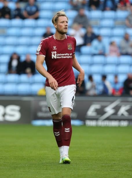 Fraser Horsfall of Northampton Town in action during the Carabao Cup 1st round match between Coventry City and Northampton Town at The Coventry...