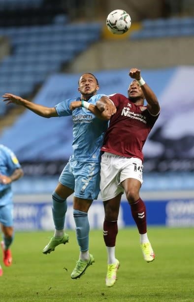 Ali Koiki of Northampton Town contests the ball with Jodi Jones of Coventry City during the Carabao Cup 1st round match between Coventry City and...