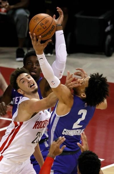 Alperen Sengun of the Houston Rockets and Cade Cunningham of the Detroit Pistons fight for a rebound during the 2021 NBA Summer League at the Thomas...
