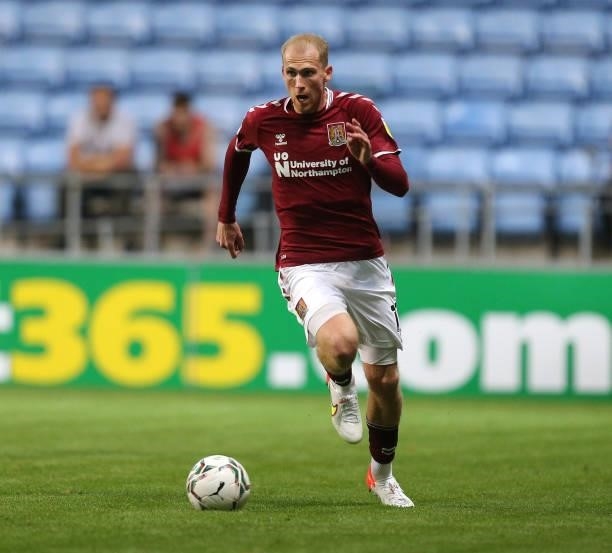 Mitch Pinnock of Northampton Town in action during the Carabao Cup 1st round match between Coventry City and Northampton Town at The Coventry...