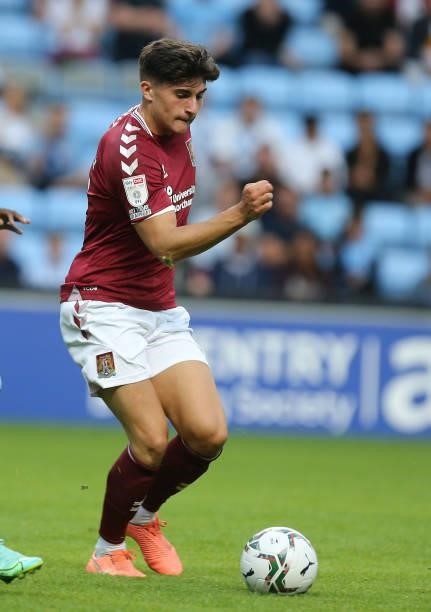 Scott Pollock of Northampton Town in action during the Carabao Cup 1st round match between Coventry City and Northampton Town at The Coventry...