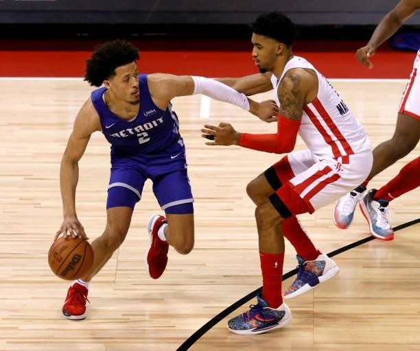 Cade Cunningham of the Detroit Pistons drives against KJ Martin of the Houston Rockets during the 2021 NBA Summer League at the Thomas & Mack Center...