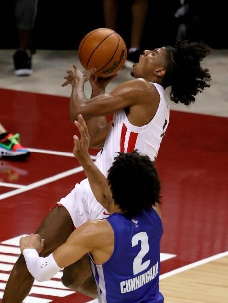 Jalen Green of the Houston Rockets is fouled as he drives to the basket against Cade Cunningham of the Detroit Pistons during the 2021 NBA Summer...