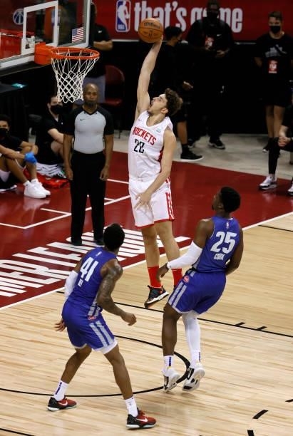 Alperen Sengun of the Houston Rockets dunks in front Saddiq Bey and Tyler Cook of the Detroit Pistons during the 2021 NBA Summer League at the Thomas...