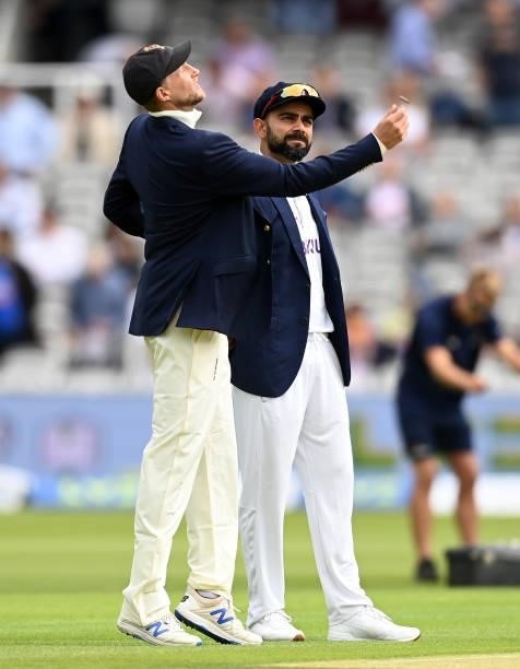 England captain Joe Root tosses the coin alongside India captain Virat Kohli ahead of day one of the Second LV= Insurance Test Match between England...