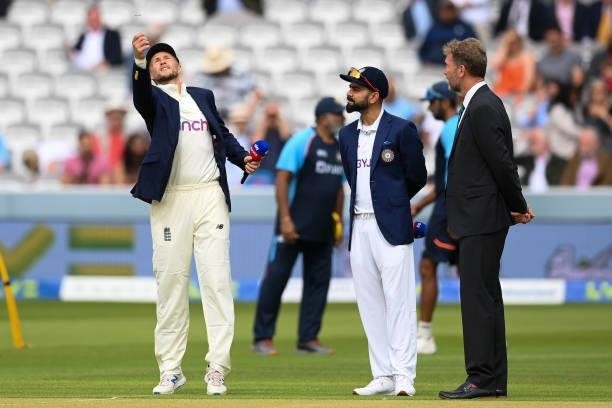 Joe Root of England tosses the coin as Virat Kohli of India looks on during the Second LV= Insurance Test Match: Day One between England and India at...