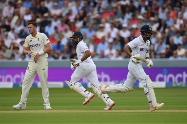 Rohit Sharma and KL Rahul of India run a single as Ollie Robinson of England looks on during the Second LV= Insurance Test Match: Day One between...