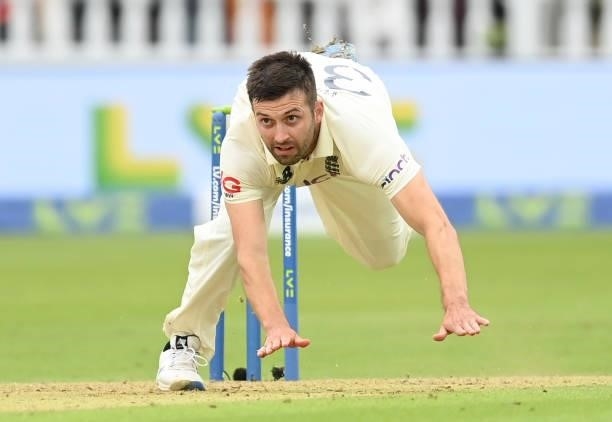 Mark Wood of England falls over after bowling during the 2nd LV= Test match between England and India at Lord's Cricket Ground on August 12, 2021 in...
