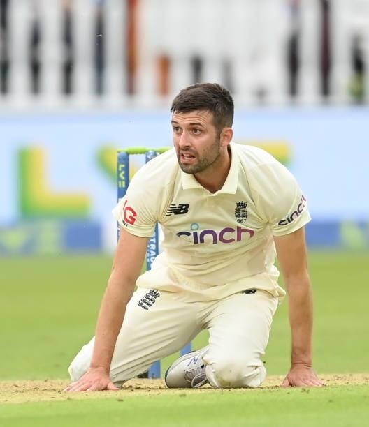 Mark Wood of England on the ground after falling while bowling during the 2nd LV= Test match between England and India at Lord's Cricket Ground on...