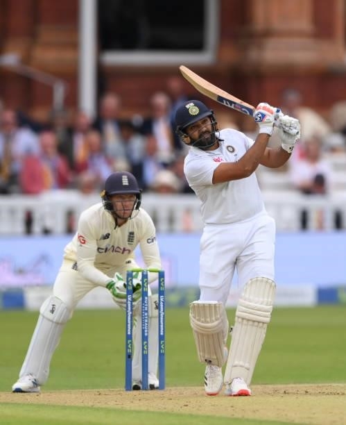 India batsman Rohit Sharma hits a ball from Moeen Ali to the boundary watched by Jos Buttler during day one of the Second Test Match between England...