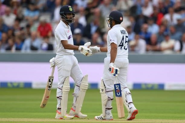 Rohit Sharma and KL Rahul of India shake hands after reaching their century partnership during the Second LV= Insurance Test Match: Day One between...
