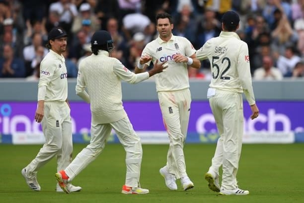 Jimmy Anderson of England celebrates with team mates after dismissing Cheteshwar Pujara of India of India during the Second LV= Insurance Test Match:...