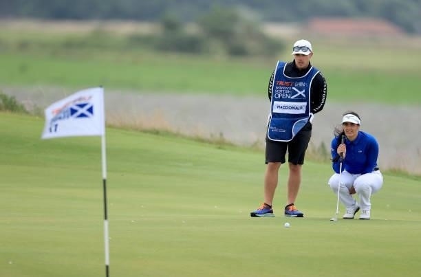 Kelsey Macdonald of Scotland lines up a putt on the 17th hole during the first round of the Trust Golf Women's Scottish Open at Dumbarnie Links on...