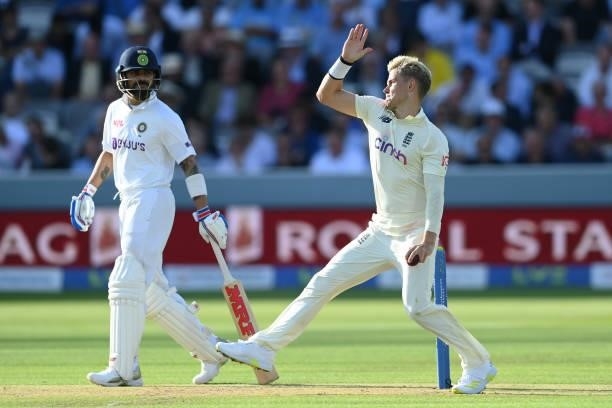 Sam Curran of England bowls as Virat Kohli of India looks on during the Second LV= Insurance Test Match: Day One between England and India at Lord's...