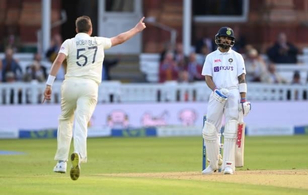 England bowler Ollie Robinson takes the wicket of Virat Kohli during day one of the Second Test Match between England and India at Lord's Cricket...