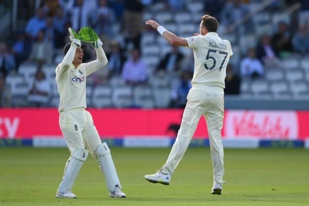 Ollie Robinson of England celebrates with Jos Buttler after dismissing Virat Kohli of India during the Second LV= Insurance Test Match: Day One...