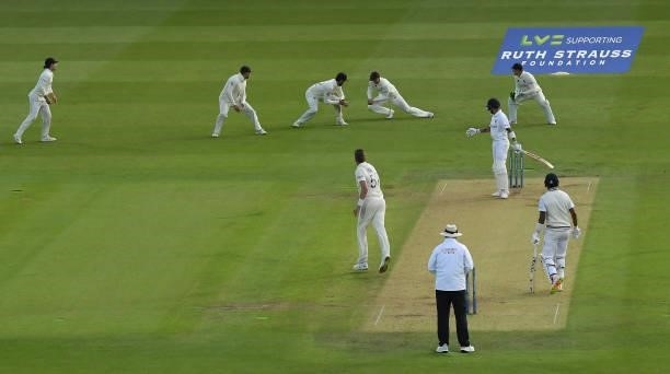 Joe Root of England catches Virat Kohli of India during the 2nd LV= Test match between England and India at Lord's Cricket Ground on August 12, 2021...